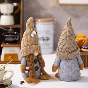 Close-up of coffee gnome plush with knitted hat and wooden coffee bean details