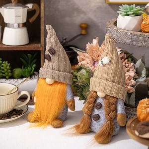 Detail of coffee gnome plushies with knitted hats and coffee bean decor for cafe display