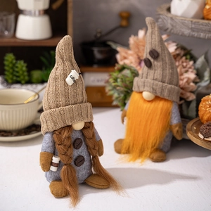 Detailed view of coffee gnome plush figurines with knitted hats and coffee bean decor