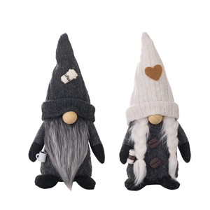 Pair of knitted coffee gnomes with heart decor and mini coffee cups for home cafe style