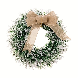 Artificial green leaf wreath with burlap bow and white flowers for front door decor