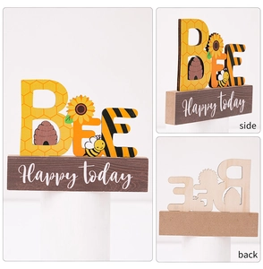 Three-angle view of wood Bee Happy Today table decor with sunflower and hive patterns