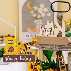 Close-up of wooden bee tiered tray decor with sunflower patterns and Happy Today text