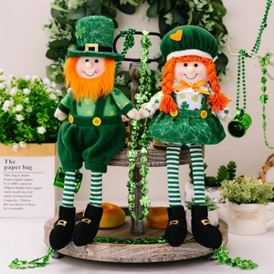 St. Patrick's Day gnome plush dolls with clover patterns on wooden display stand