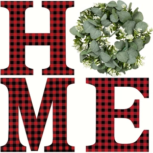 HOME sign with red and black buffalo plaid letters and green eucalyptus wreath