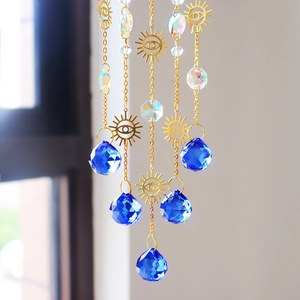 Bohemian sun catcher with gold eye pendant and blue faceted crystal prism hanging decor