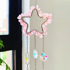 Pink quartz star suncatcher with moonstones and crystal pendants on hanging metal chains