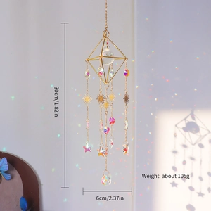 Golden geometric suncatcher with crystal prisms creating rainbows on a wall