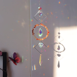 Detailed view of crystal suncatcher casting vibrant rainbow reflections on the wall