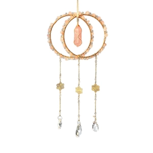 Handmade rose quartz suncatcher with golden rings and hanging crystal prisms for home decor