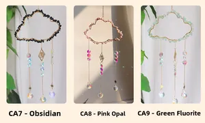 Detailed view of cloud-shaped crystal suncatchers with obsidian, pink opal and fluorite