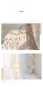 Close-up of colorful crystal cloud suncatcher creating vibrant rainbow light patterns