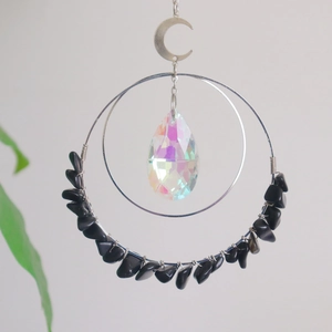 Handmade metal suncatcher with colorful crystal pendant and black gemstone beads