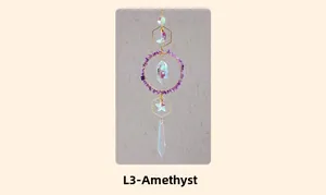 Close-up of crescent moon suncatcher with amethyst stones and crystal prism pendant