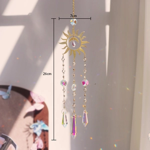 Detailed view of golden sun and moon suncatcher with crystal prisms measuring 26cm in length