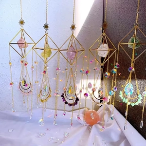 Set of five bohemian crystal suncatchers with metal frames and colorful raw stones