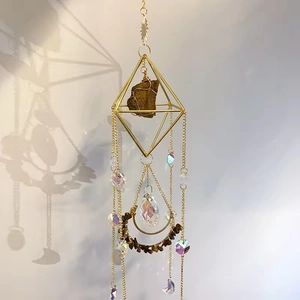 Detailed view of rhombic metal suncatcher with amethyst stones and crystal drops