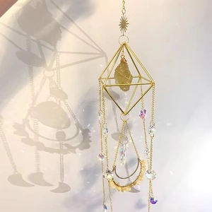 Detailed close-up of golden diamond frame suncatcher with purple crystal beads