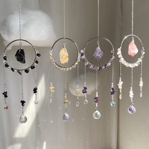 Set of four crystal suncatchers with natural raw stones and rainbow prisms for home decor