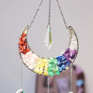 Detail of crescent moon suncatcher with rainbow natural stones and crystal prism