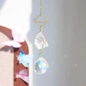 Detailed close-up of crystal suncatcher with white quartz and AB rainbow pendant ball