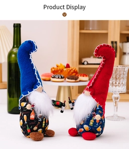 Close-up of Independence Day gnomes holding miniature beer bottles on a festive table