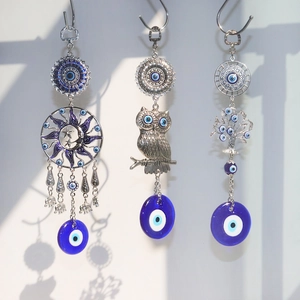Silver Evil Eye suncatcher ornaments with tree of life, owl, and moon designs for garden decor