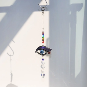 Detail of evil eye suncatcher with chakra beads and faceted crystal ball pendant