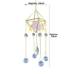 Detail view of pink crystal suncatcher with golden moon accent and rainbow crystal balls