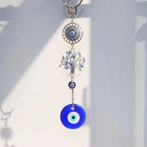Evil Eye Tree of Life suncatcher with blue glass pendants for garden and home wall decor