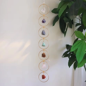 Vertical wall hanging with seven chakra natural raw stones and golden metal rings