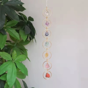 Seven chakra raw stone hanging ornament with golden rings and tree of life style crystals