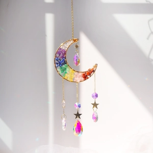 Moon shaped suncatcher with colorful crystals and gold stars for window decoration