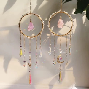 Handmade gold suncatcher with raw purple crystal stone and hanging prism crystals