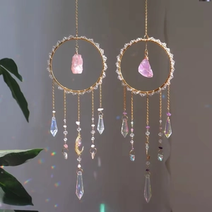 Bohemian suncatcher pendants with crystal stones and metal hoops reflecting rainbow light