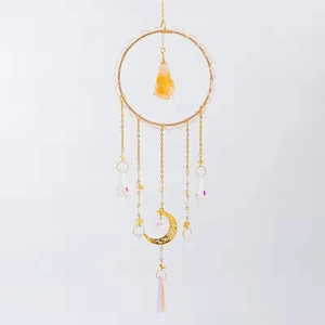 Golden crystal suncatcher with moon and star charms and raw citrine stone pendant