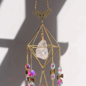 Golden butterfly suncatcher with raw crystal stone and iridescent beads for home decor
