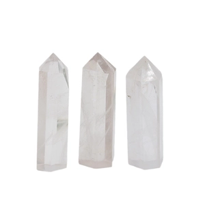 Three clear white quartz crystal hexagonal towers with natural internal ice cracks