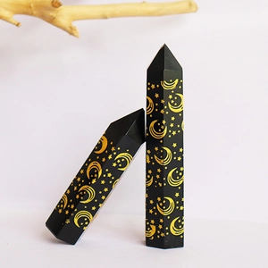 Polished obsidian hexagonal crystal columns with gold sun and moon engraving for healing