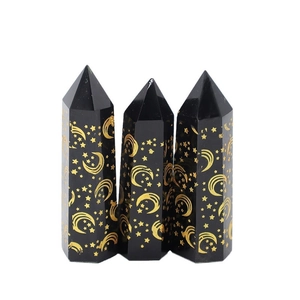 Obsidian hexagonal crystal pillars with gold sun and moon motifs for energy healing