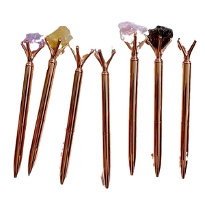 Set of 7 rose gold crystal pens featuring natural amethyst and quartz raw stone tops