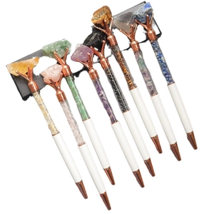 Set of seven white crystal gemstone ballpoint pens with rose gold accents on gift box