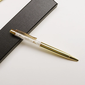 Golden crystal ballpoint pen with crushed white stones in a black gift box