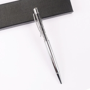 Close-up of silver crystal ballpoint pen with black sparkling diamond stone filling