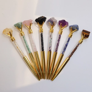 Set of 8 golden ballpoint pens with natural raw crystals and polished gemstones