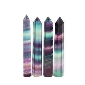 Set of four natural fluorite hexagonal crystal points with green and purple stripes