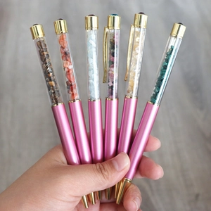 Set of six creative crystal filled ballpoint pens with gold accents and pink barrel