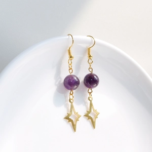 Elegant gold drop earrings with purple amethyst beads and sparkling star charms