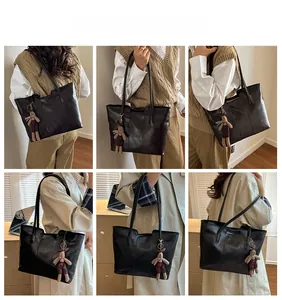 Detailed views of a large black leather tote bag featuring a cute plush bear charm accessory