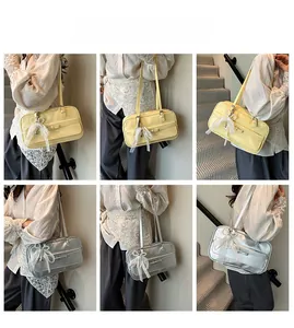 Detailed views of women's underarm boston bag with lace bow and pearl pendant accessories